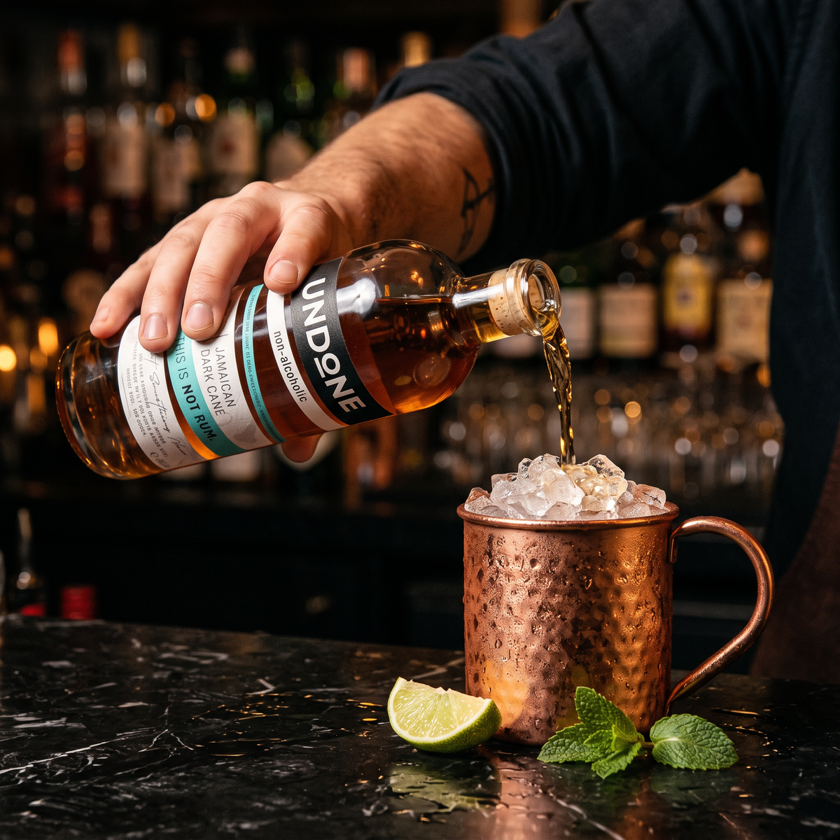 Bartender pouring UNDONE No. 1 NOT RUM into a copper mug of crushed ice