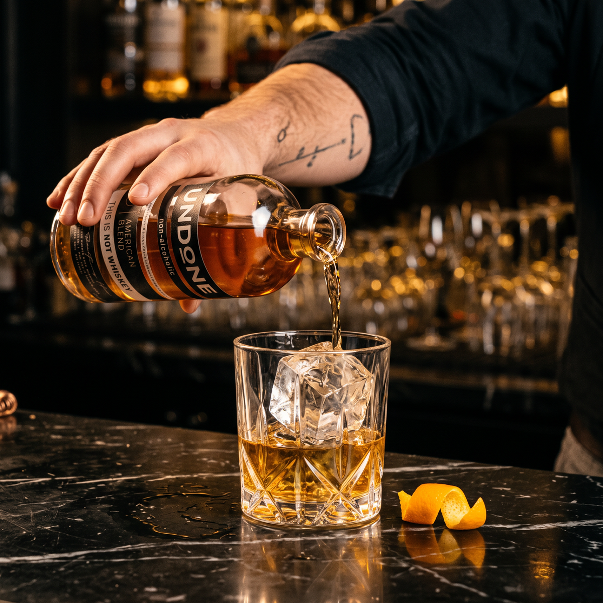 Bartender pouring UNDONE No. 3 NOT WHISKEY over a large ice cube